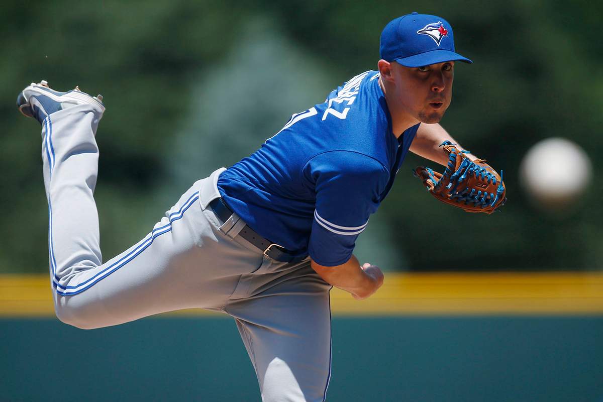 Toronto Blue Jays starting pitcher Aaron Sanchez delivers a pitch to Colorado Rockies' Charlie Blackmon in the first inning of a baseball game Wednesday, June 29, 2016, in Denver.