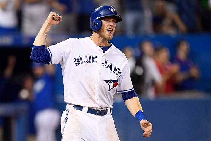 Toronto Blue Jays' Michael Saunders celebrates after scoring on a two-run single by Troy Tulowitzki against the Detroit Tigers during eighth inning MLB baseball action, in Toronto on Thursday, July 7, 2016. 