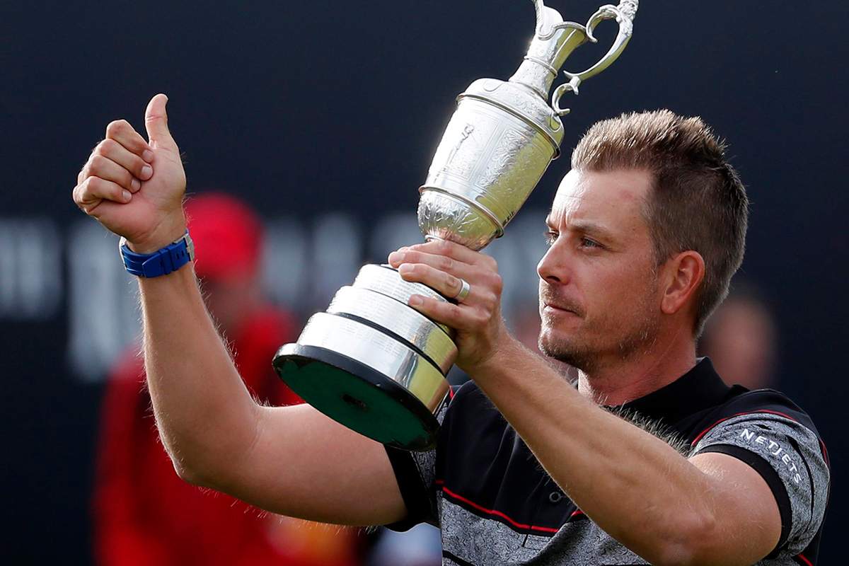 Henrik Stenson of Sweden holds up the trophy tom the crowd after winning the British Open Golf Championships at the Royal Troon Golf Club in Troon, Scotland, Sunday, July 17, 2016. 