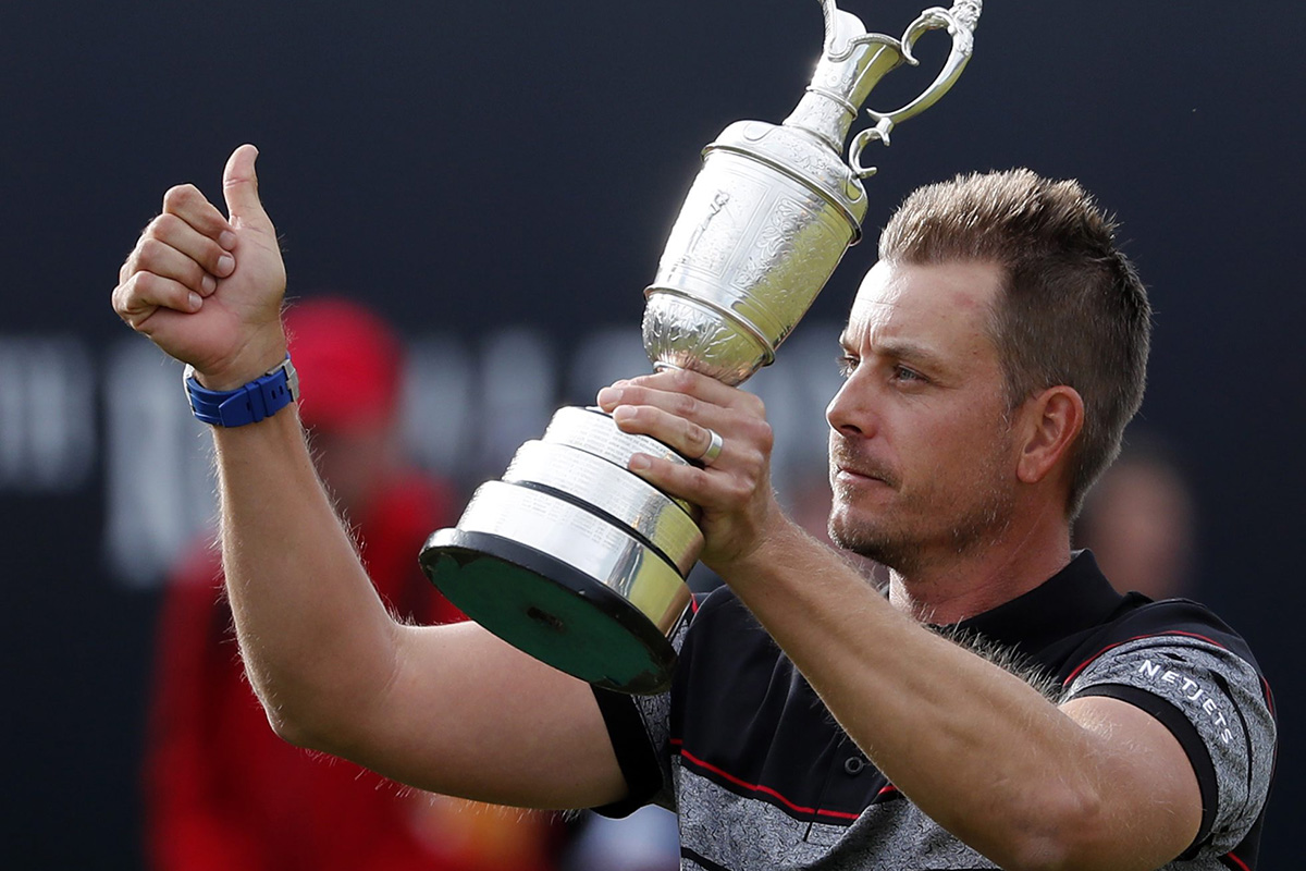 Henrik Stenson of Sweden holds up the trophy tom the crowd after winning the British Open Golf Championships at the Royal Troon Golf Club in Troon, Scotland, Sunday, July 17, 2016. 
