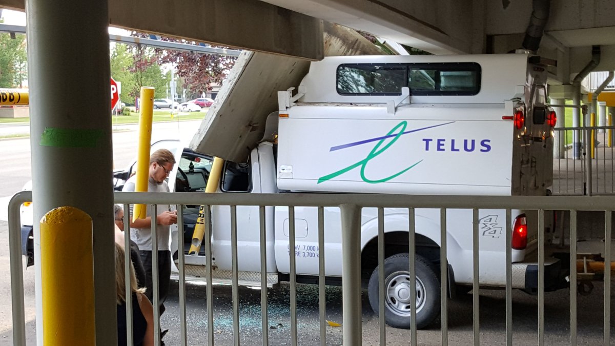 A Telus vehicle  is damaged colliding into a section of a Londonderry Mall parkade, Friday, July 15, 2016. 
