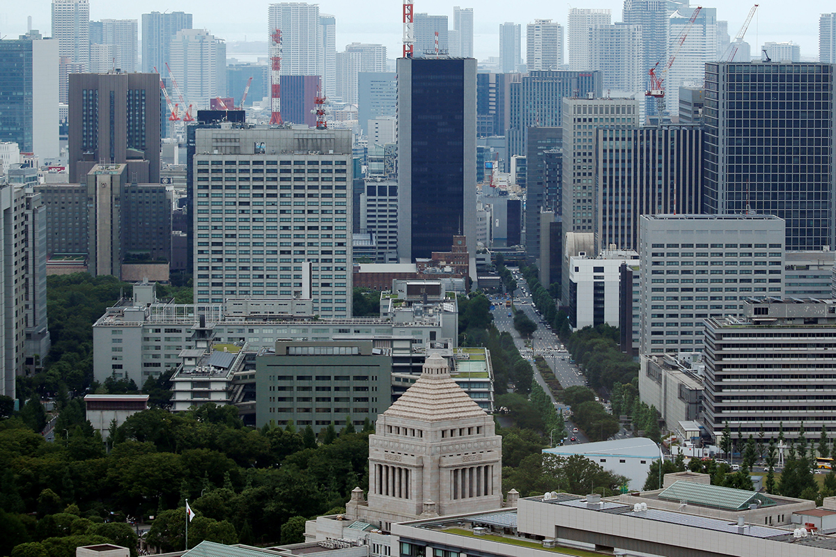 The Parliament Building (bottom) is seen in front of office buildings of government ministeries in Tokyo, Japan July 19, 2016.