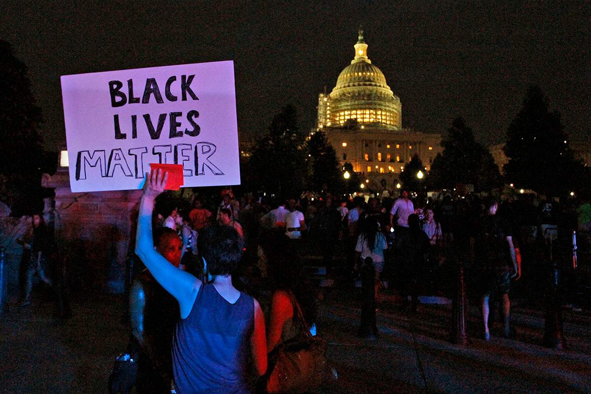 A Black Lives Matter sign is held up near the Capitol as a protest march about police brutality arrived after having started near the White House, Thursday, July 7, 2016, in Washington. 
