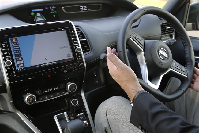 A draft vehicle technology bill was tabled by the UK government suggesting that self-driving cars and their manufacturers should be liable for accidents, not the person sitting behind the wheel. (AP Photo/Shizuo Kambayashi).