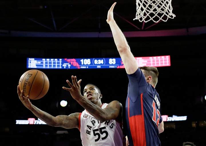 Toronto Raptors guard Delon Wright (55), defended by Detroit Pistons center Aron Baynes (12), makes  layup during the second half of an NBA basketball game, Sunday, Feb. 28, 2016, in Auburn Hills, Mich.