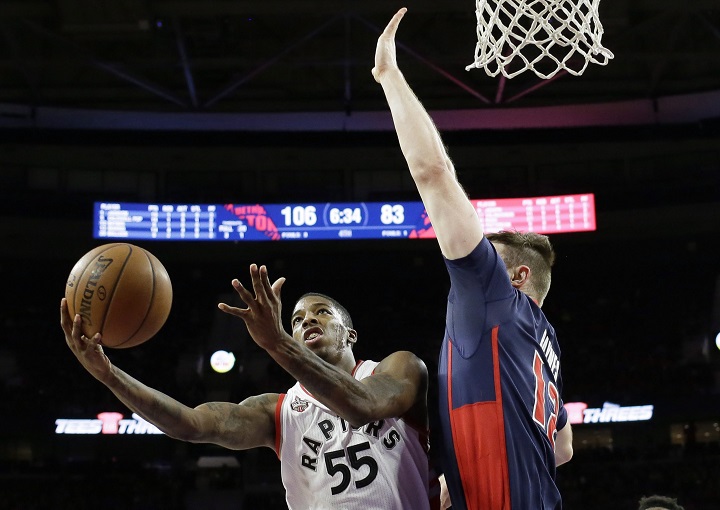 Toronto Raptors guard Delon Wright (55), defended by Detroit Pistons center Aron Baynes (12), makes  layup during the second half of an NBA basketball game, Sunday, Feb. 28, 2016, in Auburn Hills, Mich.