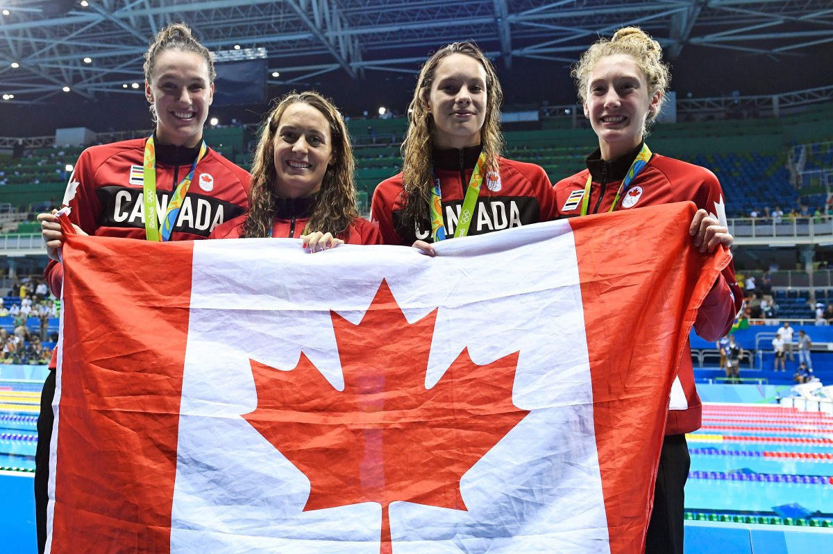 The Canadian women's 4x100-metre freestyle relay team, left to right, Chantal van Landeghem, Sandrine Mainville, Penny Oleksiak and Taylor Ruck show off their bronze medal at the 2016 Summer Olympics, in Rio de Janeiro, Brazil, Saturday, Aug. 6, 2016.