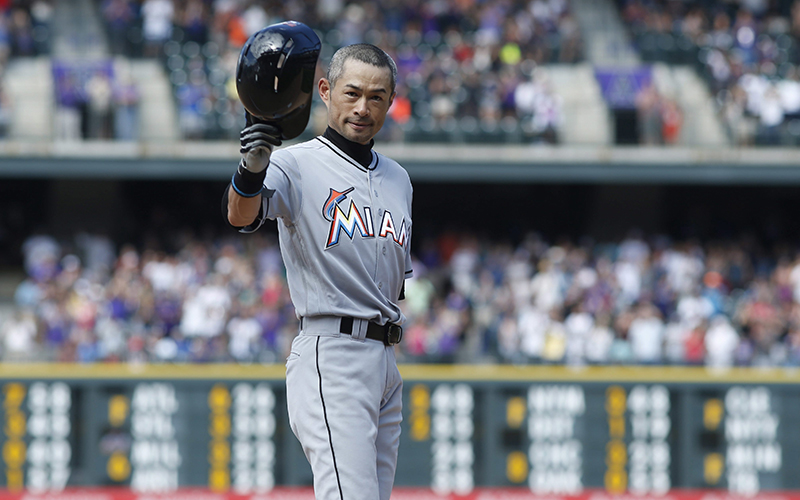Miami Marlins' Ichiro Suzuki tips his batting helmet to the crowd to acknowledge applause after he tripled off Colorado Rockies relief pitcher Chris Rusin in the seventh inning of a baseball game, Sunday, Aug. 7, 2016 in Denver. The hit was the 3,000th in his Major League career. 