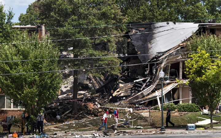 A fire and explosion destroyed part of the Flower Branch Apartment Complex in Silver Spring, Maryland, USA, 11 August 2016. 