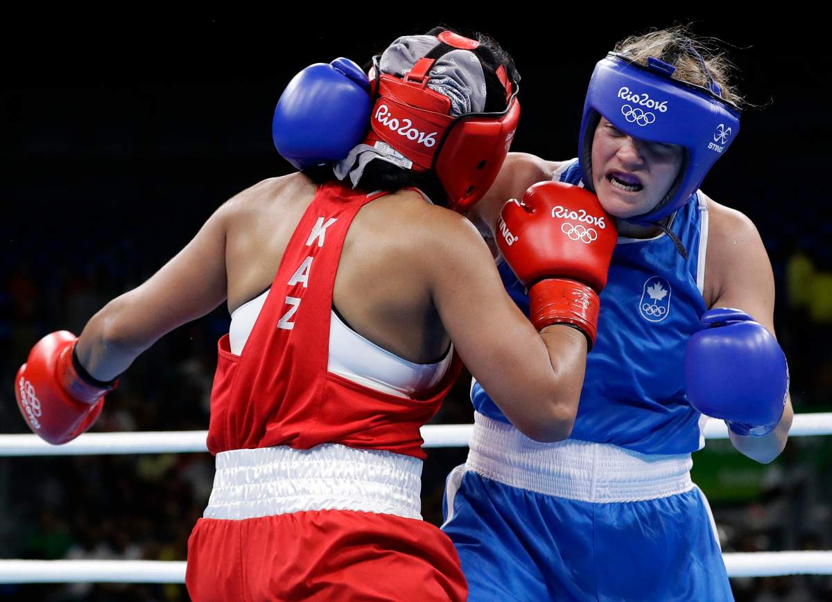 Canada’s Ariane Fortin, right, and Kazakhstan’s Dariga Shakimova exchange punches during a women’s middleweight 75-kg preliminary boxing match at the 2016 Summer Olympics in Rio de Janeiro, Brazil, Sunday, Aug. 14, 2016.
