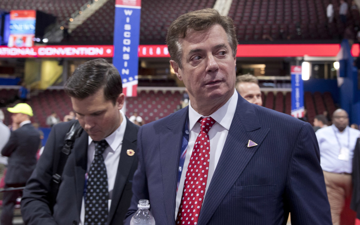 Trump campaign chairman Paul Manafort walks around the convention floor before the opening session of the Republican National Convention in Cleveland.  