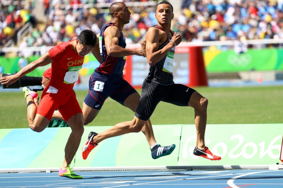  Su Bingtian (CHN) of China, Jimmy Vicaut (FRA) of France and Andre De Grasse (CAN) of Canada compete.    