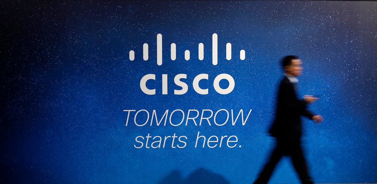 A visitor walks past a Cisco advertising panel at the Mobile World Congress in Barcelona February 27, 2014. Photo.