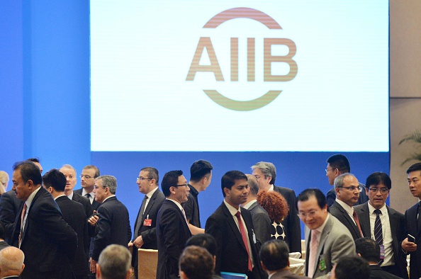 People attend the first annual meeting of the Asian Infrastructure Investment Bank in Beijing on June 25, 2016. (Photo by Kyodo News via Getty Images).