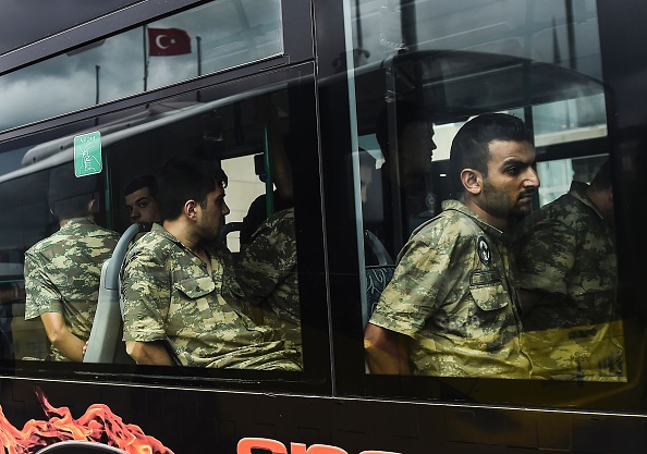 Detained Turkish soldiers who allegedly took part in a military coup arrive in a bus at the courthouse in Istanbul on July 20, 2016, following the military coup attempt of July 15.
