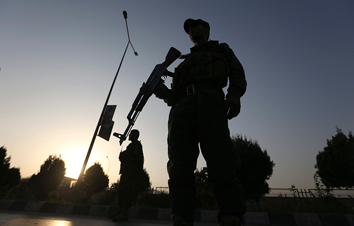 Afghan security forces stand guard after an attack on the American University of Afghanistan in Kabul, Afghanistan, Thursday, Aug. 25, 2016. 