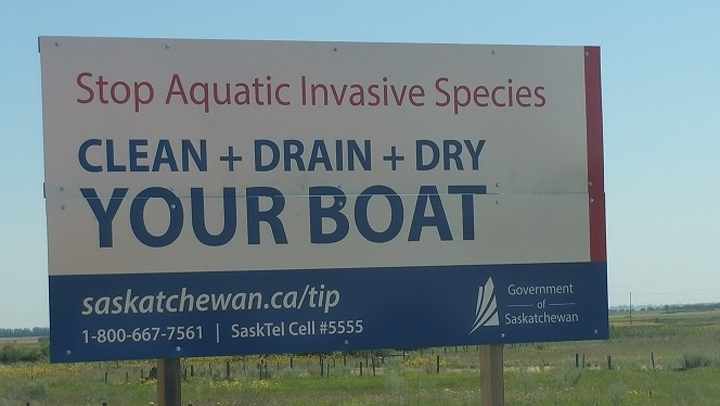 Saskatchewan places new highway signs telling boaters to clean, drain and dry boats to stop the spread of aquatic invasive species.