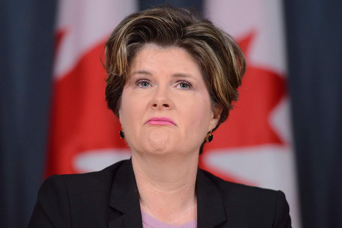 Alison Azer holds a press conference at the National Press Theatre in Ottawa on July 5, 2016.