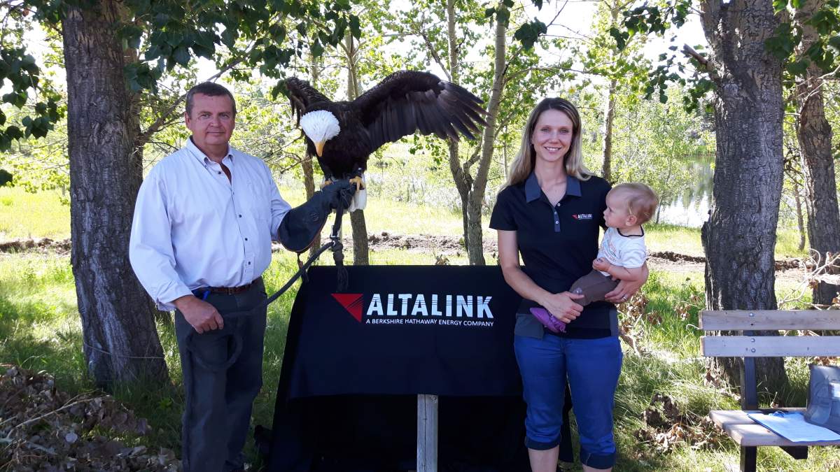 Alberta Birds of Prey managing director Colin Weir stands with AtaLinks, Nikki Heck as they are nearing the finish on a new trail at the centre