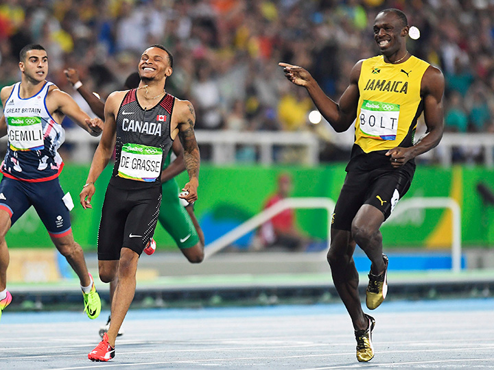 Canada's Andre De Grasse and Jamaica's Usain Bolt share a laugh as they compete during the men's 200-metre semi-finals at the 2016 Summer Olympics in Rio de Janeiro, Brazil, Wednesday, August 17, 2016. 