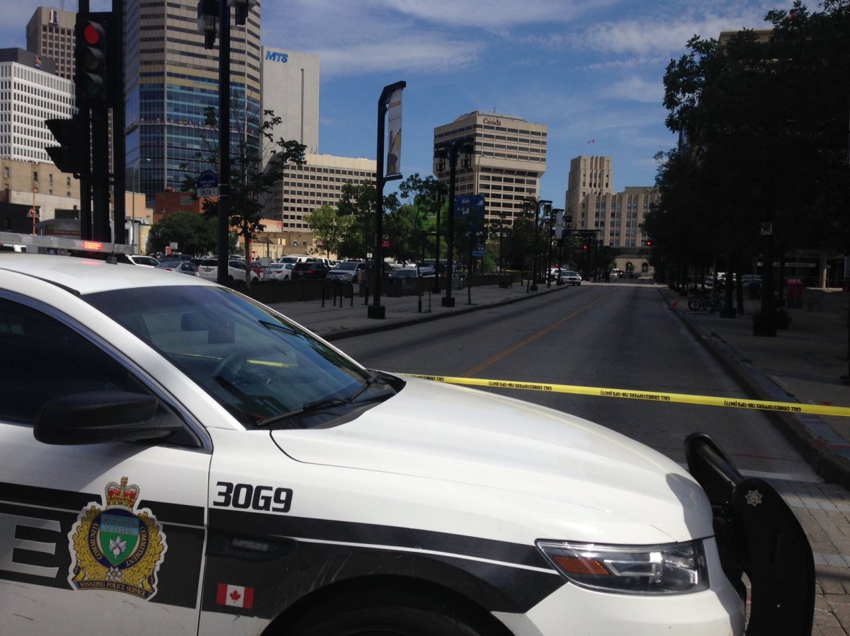 Winnipeg police have reopened Garry Street after deeming a suspicious package found on the street was not a threat.