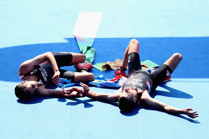 Alistair Brownlee and Jonathan Brownlee of Great Britain celebrate during the Men’s Triathlon at Fort Copacabana on Day 13 of the 2016 Rio Olympic Games on August 18, 2016 in Rio de Janeiro, Brazil.