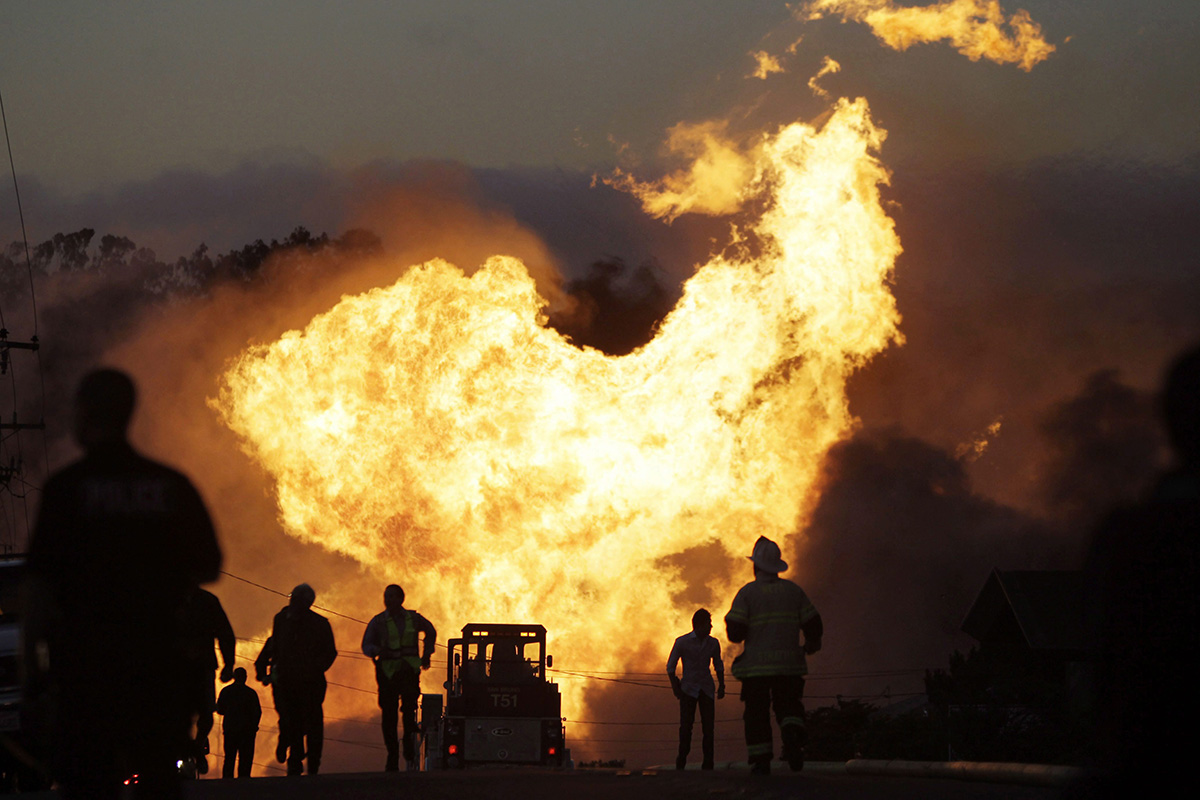  In this Sept. 9, 2010, file photo, a massive fire roars through a neighborhood in San Bruno, Calif. U.S. officials are moving to strengthen natural gas pipeline safety rules following decades of fiery accidents including the 2010 California explosion that killed 8 people and injured more than 50.