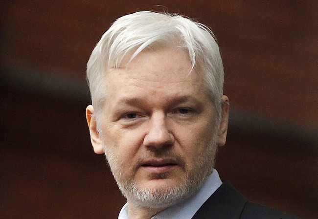 FILE - In this Feb. 5, 2016, file photo, WikiLeaks founder Julian Assange stands on the balcony of the Ecuadorean Embassy in London.