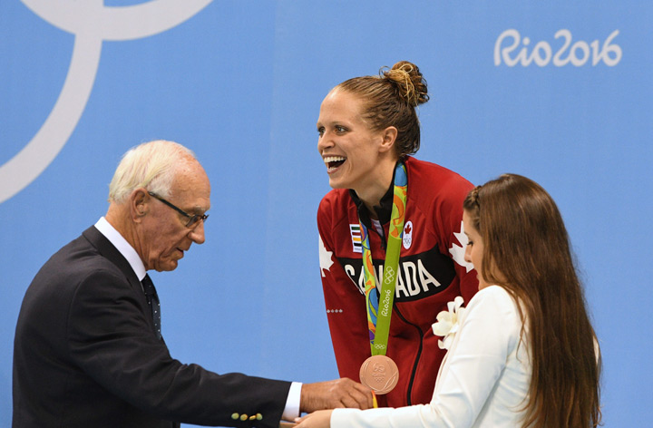 Canada’s Hilary Caldwell celebrates bronze in the women’s 200m backstroke finals during the 2016 Olympic Summer Games in Rio de Janeiro, Brazil on Friday, August 12, 2016.
