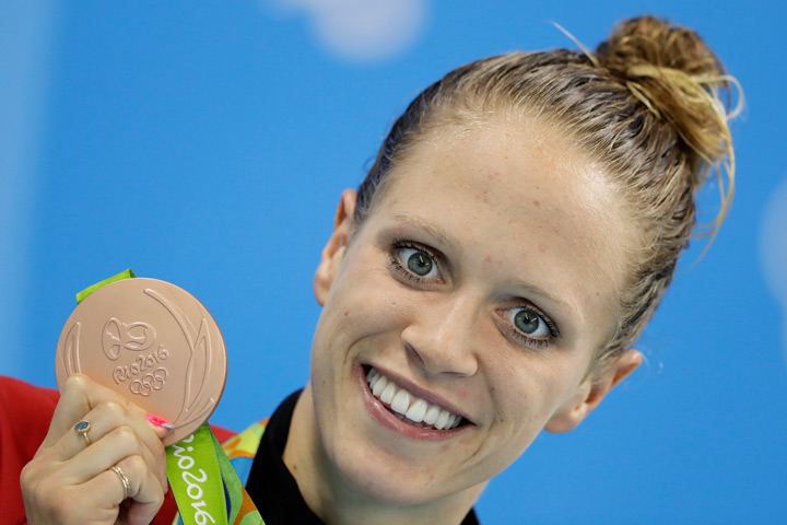 Canada's Hilary Caldwell celebrates with her bronze medal during the women's 200-meter backstroke medals ceremony during the swimming competitions at the 2016 Summer Olympics, Friday, Aug. 12, 2016, in Rio de Janeiro, Brazil.