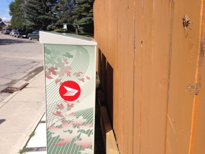 A Calgary resident said he had to contact Canada Post repeatedly to get them to move a community mailbox so he could paint his fence.