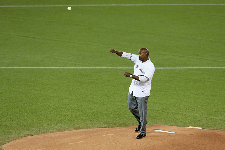 Toronto Blue Jays former player Carlos Delgado throws out the ceremonial first pitch prior to game four of the American League Championship. (Vaughn Ridley/Getty Images)