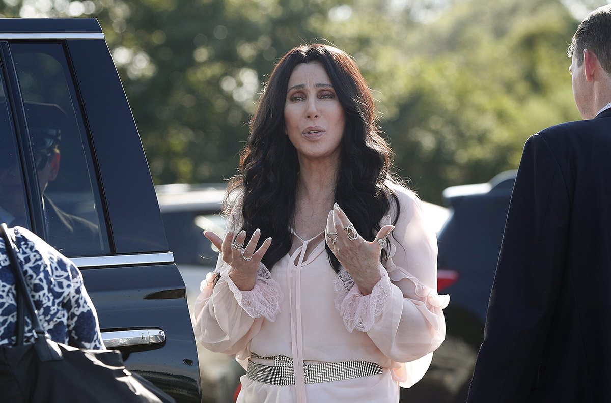Singer and actress Cher stops to talk to media as she leaves a fundraiser for Democratic presidential candidate Hillary Clinton at the Pilgrim Monument and Provincetown Museum in Provincetown, Mass., Sunday, Aug. 21, 2016. 