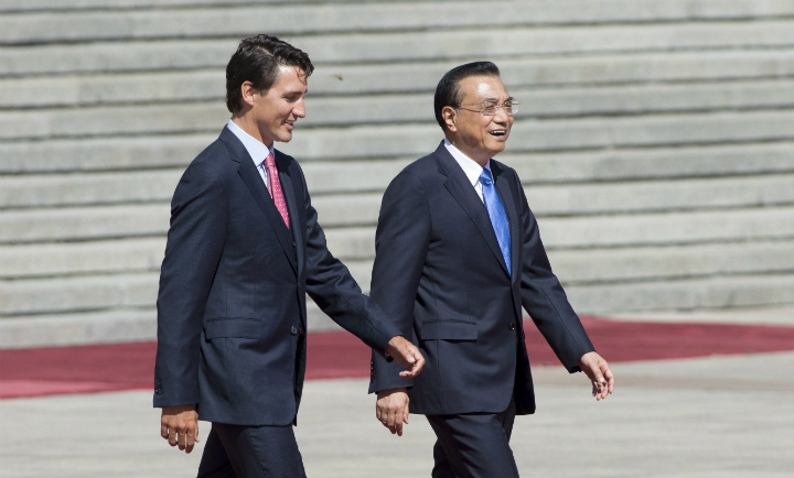 The Premier of the People's Republic of China Li Keqiang laughs as he speaks with Canadian Prime Minister Justin Trudeau during an official welcoming ceremony outside the Great Hall of the People, in Beijing, China, on Wednesday August 31, 2016. 