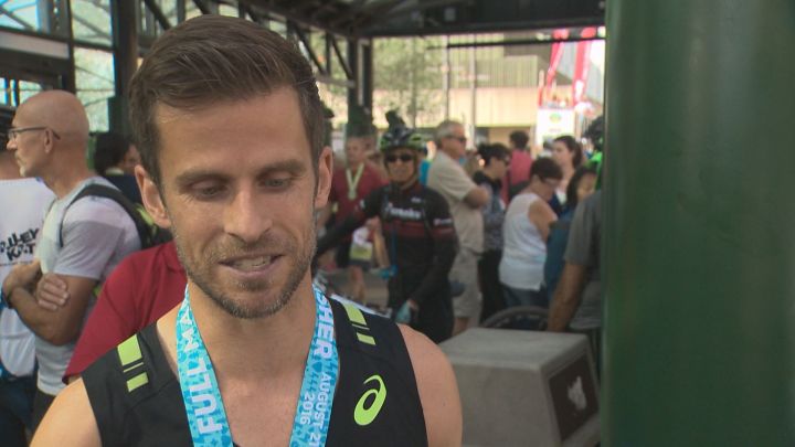 Chris Stone was the first Edmontonian to cross the finish line in the full marathon at the 2016 Edmonton Marathon. Aug. 21, 2016.
