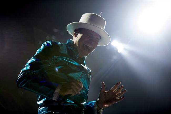 Frontman of the Tragically Hip Gord Downie leads the band through a concert in Vancouver, Sunday, July 24, 2016.