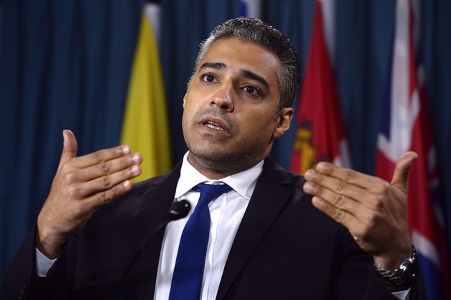 Mohamed Fahmy hold a news conference about the "Protection Charter" in Ottawa on Tuesday, Jan. 26, 2016.