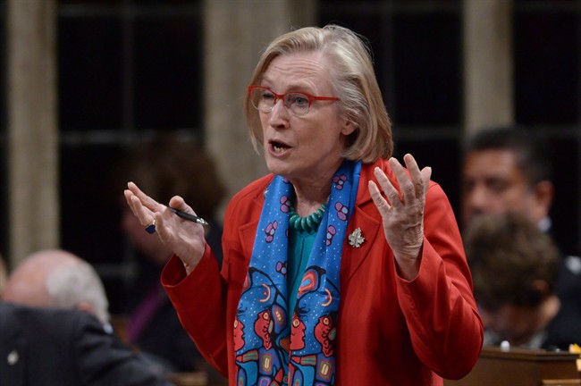 Native Affairs Minister Carolyn Bennett answers a question during Question Period in the House of Commons on Parliament Hill in Ottawa on Wednesday, June 15, 2016. Bennett says she'd like to see a lawsuit over the '60s Scoop taken out of court and discussed at a table.