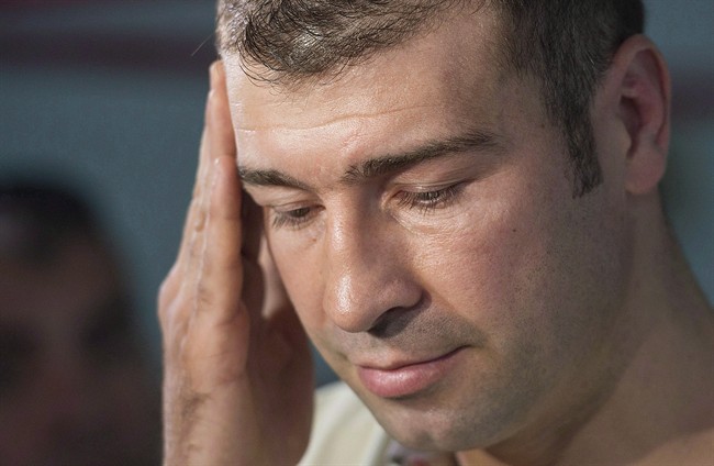 Boxer Lucian Bute speaks to reporters in Montreal, Friday, May 27, 2016, following a drug test where he tested positive for a banned substance. Former boxing champion Lucian Bute said a supplement he took to help him sleep contained the banned substance Ostarine and led to his positive doping test.