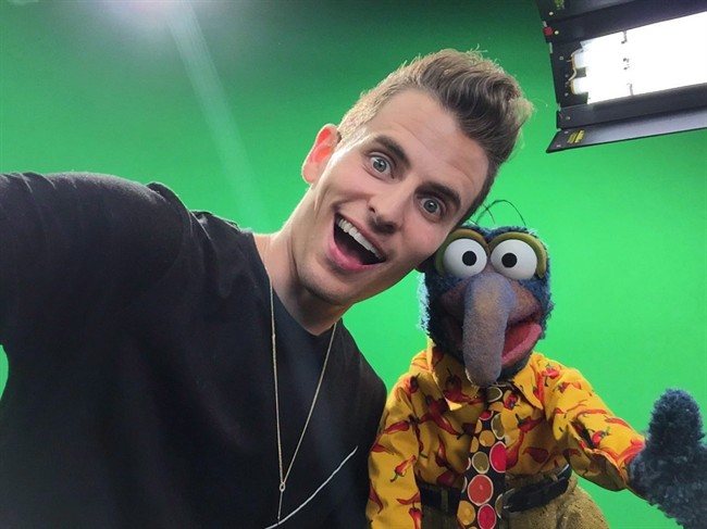 Canadian YouTube star Mike Tompkins still marvels at the celebrity power that came through for a music video he co-created in support of Hillary Clinton. This photo provided by YouTube Space LA shows Mike Tompkins, left, and Gonzo of the Muppets. 