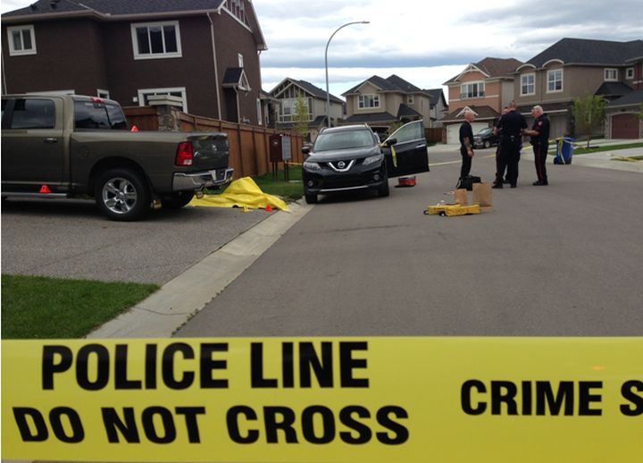 Police tape surrounds the area where a body was found in Cranston Saturday.
