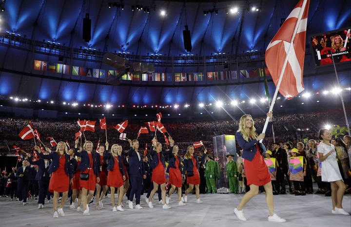 Caroline Wozniacki carries the flag of Denmark during the opening ceremony for the 2016 Summer Olympics in Rio de Janeiro, Brazil, Friday, Aug. 5, 2016.