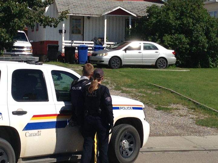RCMP surrounded a house on 14 Street in Didsbury Friday, Aug. 12, 2016.
