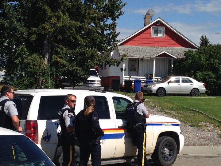 RCMP surrounded a house on 14 Street in Didsbury Friday, Aug. 12, 2016.