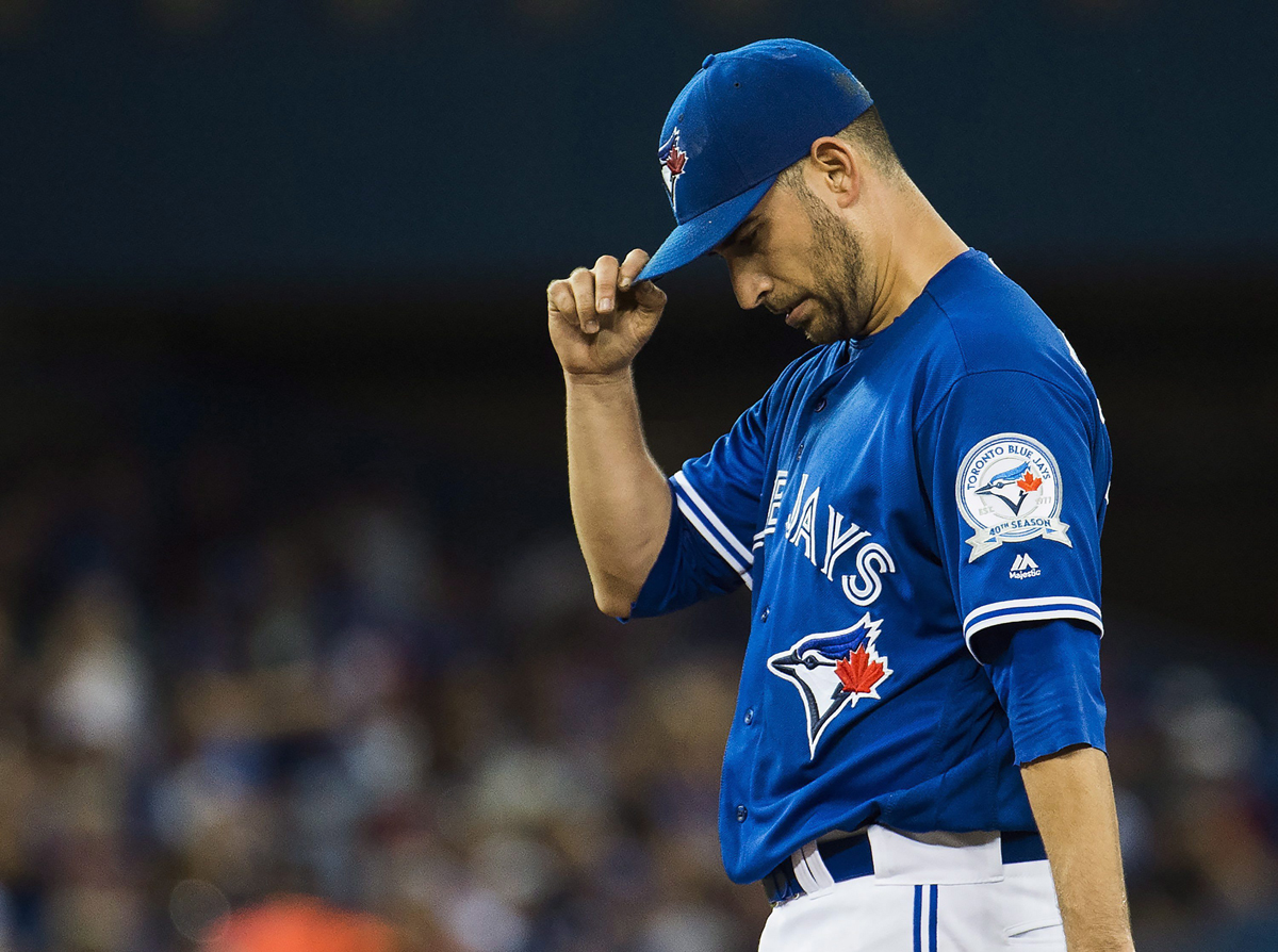 Toronto Blue Jays starting pitcher Marco Estrada (25) looks down as he works against the Tampa Bay Rays during fifth inning AL baseball action in Toronto on Tuesday, August 9, 2016. 