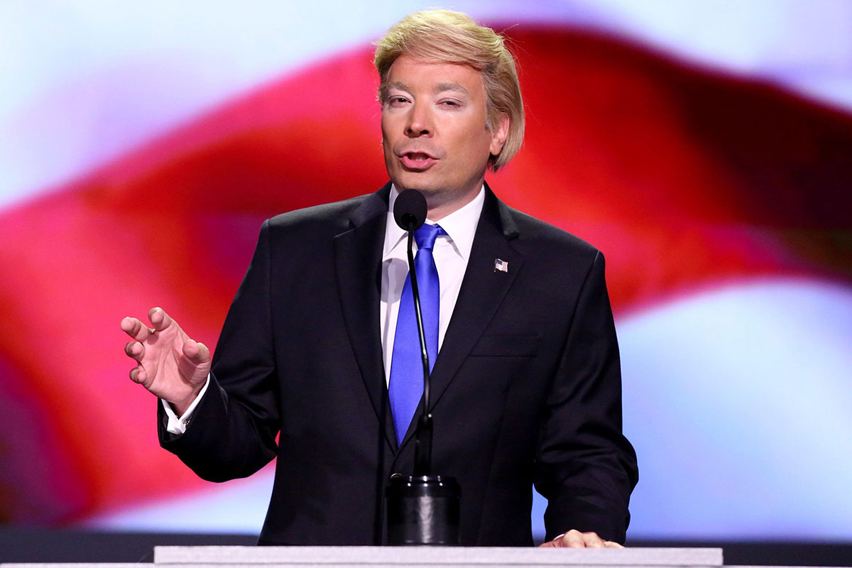 In this July 19, 2016 photo released by NBC, Jimmy Fallon impersonates Donald Trump on "The Tonight Show Starring Jimmy Fallon," in New York. In every presidential election year since 1992, the Republican candidate was mocked more by comedians than the Democrat, according to a think tank that tallies punchlines. 