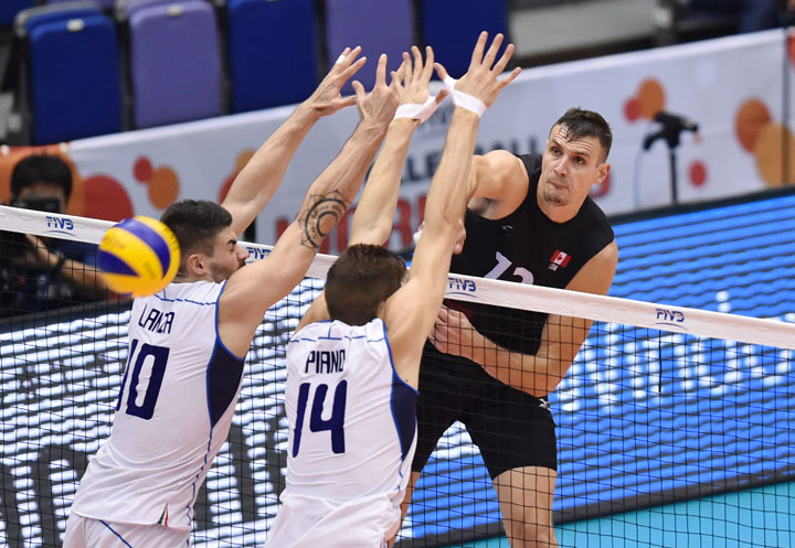 Gavin Schmitt of Canada spikes against Italy in the match between Canada and Italy during the FIVB Men's Volleyball World Cup Japan 2015 at the Hiroshima Prefectural Sports Center on September 8, 2015 in Hiroshima, Japan.