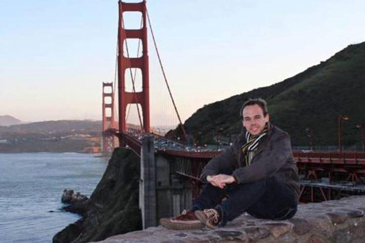In this undated photo from Facebook, Germanwings co-pilot Andreas Lubitz poses in front of the Golden Gate Bridge in San Francisco. 