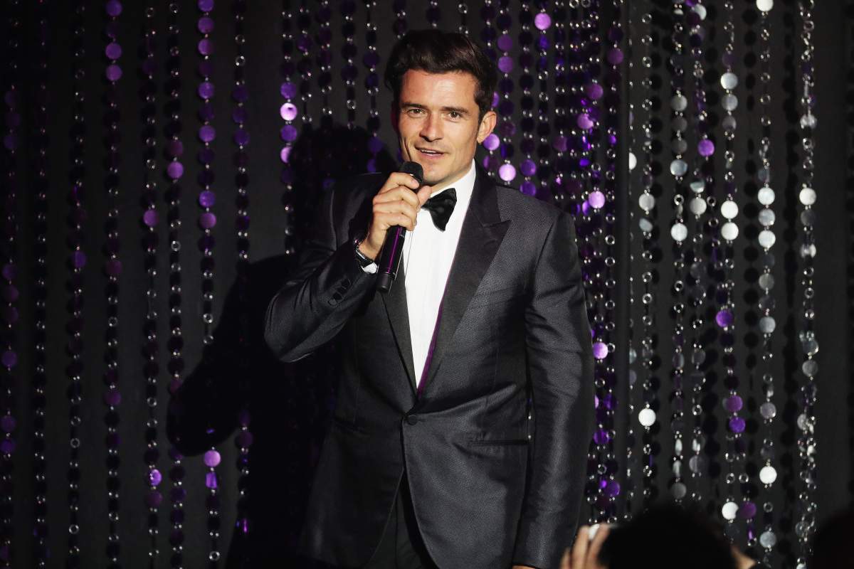 Orlando Bloom appears on stage at the amfAR's 23rd Cinema Against AIDS Gala at Hotel du Cap-Eden-Roc on May 19, 2016 in Cap d'Antibes, France.  