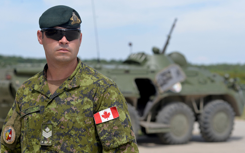A Canadian military instructor looks on during Ukrainian military exercises at the International Peacekeeping and Security Center in Yavoriv, near Lviv, on July 12, 2016. 
